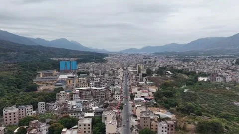 Drone view of straight highway passing through Hakka settlement in Jiangxi Stock Footage 333220533