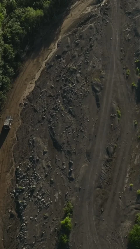 Drone view of Sukhaya River dry bed and dirt track to Avachinsky Volcano Stock Footage 346558172