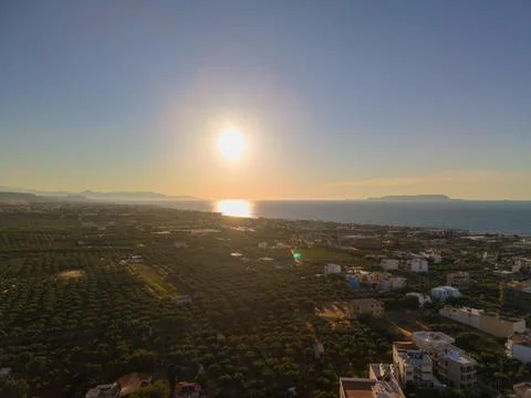 Drone View of Sun Setting Over Mediterranean Sea and Crete Coastline Stock-Fotos