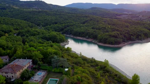 Drone view of sunlight reflections on tuscan lake Stock Footage 320861670