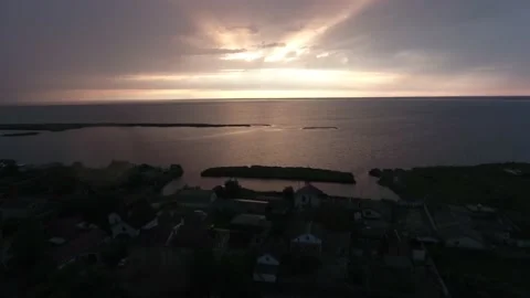 Drone View of Sunset in the clouds over the seaside village on the Stock Footage 162106470