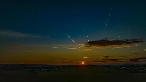 Drone View of a Sunset With Clouds, Red, Orange and Blue Sky Stock Photos
