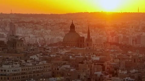 Drone view of sunset over main cathedral in Valletta city, Maltese island Stock Footage 279385525