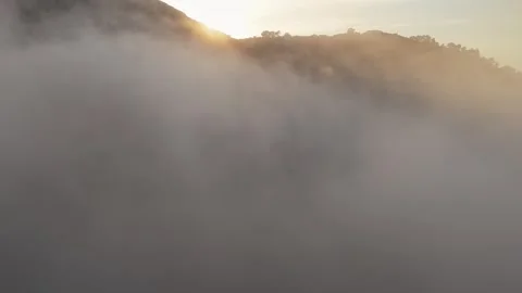 Drone view of sunset over misty Spanish mountain Stock Footage 314605730