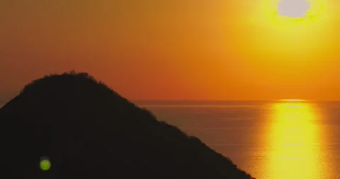 Drone view of sunset over ocean with islands in Labuan Bajo Video stock 332976067