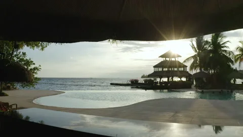 Drone View of Sunset Pool and Overwater Pavilion at Pearl Farm Stock Footage 237974021