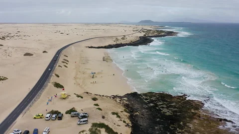 Drone view of of surfers in the beach. Stock Footage 291990747