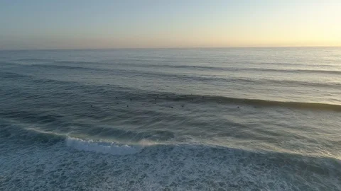 Drone view of surfers at the beach in the sunset light Vídeos de archivo 111980109