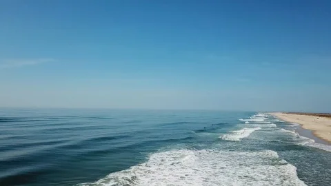 Drone view of surfers at Smith Point beach Atlantic Ocean Stock Footage 106043855