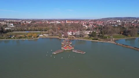Drone view of Szigetfürdő island bath on Lake Balaton amid the parkland Stock Footage 337507957