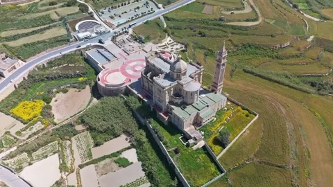 Drone view of Ta' Pinu Basilica in Gozo amid Maltese countryside fields Video stock 341386938