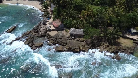 Drone View of Tangalle Beach with Waves Crashing on Rocks | Sri Lanka Aerial Foo Stock Footage 309775917