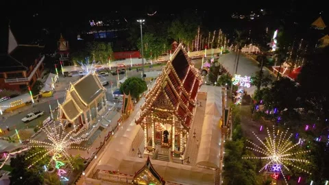 Drone view of Thai temple at night during local celebration Stock Footage 305253483
