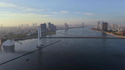 Drone view of Thuan Phuoc Bridge and Han River at sunrise in Da Nang, Vietnam Stock Footage 340874429