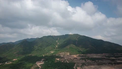Drone view time lapse hyper lapse of clouds flying through the mountain Stock Footage 152838538