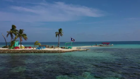Drone View of Tiny Belize Island with National Flag in Caribbean Sea 스톡 동영상 300273858