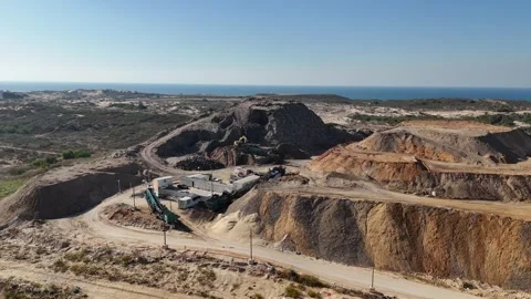 Drone view of a tire recycling facility with a large pile of old car tires Stock Footage 294722733