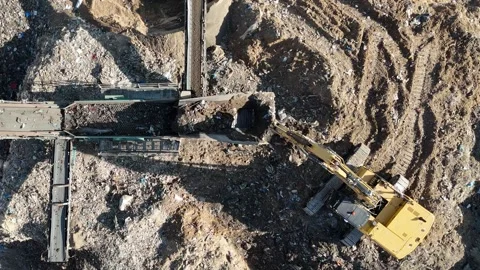 Drone view of a tire recycling facility with a large pile of old car tires Stock Footage 294722800