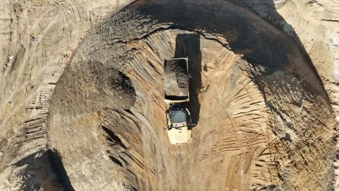 Drone view of a tire recycling facility with a large pile of old car tires Stock Footage 294722809