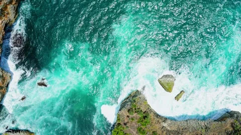 Drone view from top of beautiful beach wave crashing to the shore Stock Footage 291612664