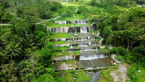 Drone view from top of small waterfall in the forest park Stock Footage 291631347