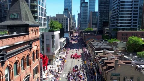 Drone View of Toronto Pride Parade Through Downtown Streets Video stock 337912624