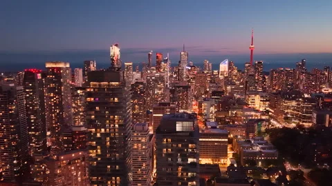 Drone view of Toronto's nighttime skyline. City lights at night. Видео 323379968