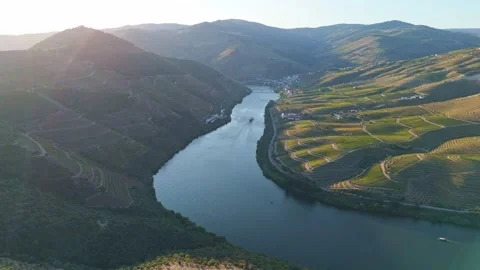 Drone view of a tourist boat on the Douro River at sunset Video stock 344287983