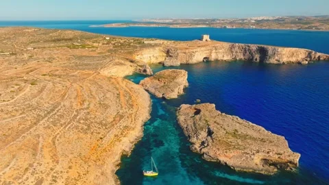 Drone view of Tower and Crystal lagoon, Comino island, Malta island Stock Footage 274806404