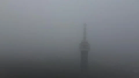 Drone View of Tower in Dense Fog 動画素材 337374178