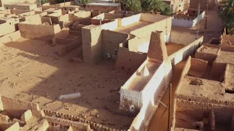 Drone view of a traditional mud-brick mosque and the historic ksar in Timimoun Stock Footage 341258622