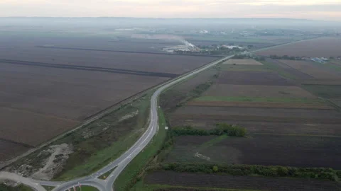 Drone view of traffic and road in the middle of plain countryside Stock Footage 262753370