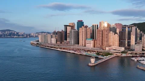 Drone view of trafficked road, buildings and sea in Hong Kong Stock Footage 337484113