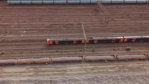 Drone View Of Train Moving Across Multiple Rail Tracks Stock Footage 334629451