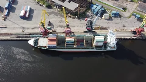 Drone view of a transport ship loading at the port Stock Footage 159060340