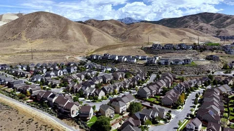 Drone View of Traverse Mountain Lehi Homes Overlooking Silicon Slopes in Summer Stock Footage 345088620