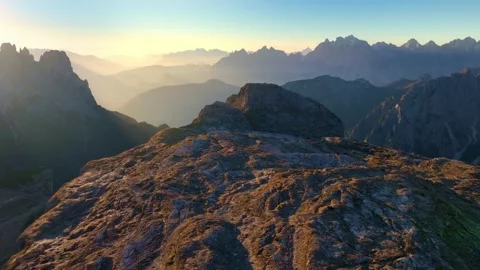 Drone view of Tre Cime di Lavaredo Dolomites mountains at sunrise. Travel in Stock Footage 291526060