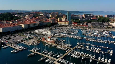 Drone view of Trieste harbour and many sailing ships on a sunny morning Stock Footage 262253597