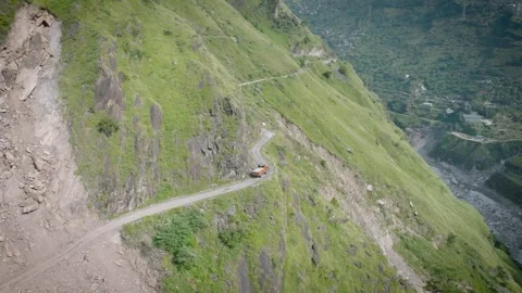 Drone View of Truck Navigating Dangerous Landslide Zone on Narrow Himalayan Road 스톡 동영상 333067863