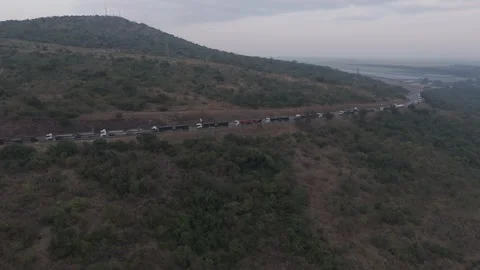 Drone view of trucks queuing for the border post in a long line through Stock Footage 278018104