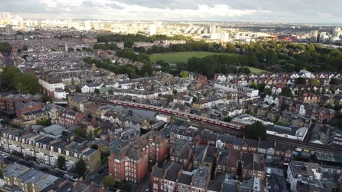 A drone view of a tube train in the Putney area of South London. Stock Footage 191551780