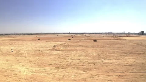 Drone view turning from an access road toward earthworks 库存影片 346430409