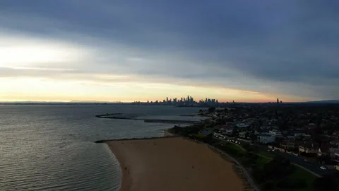 Drone view turns to City after rising from the beach Stock Footage 209130341