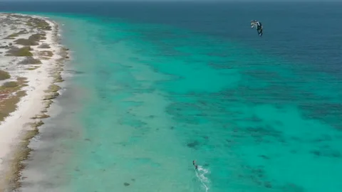 Drone view of the two kiteboarders sailing on the beautiful tropical sea Stock Footage 161027818