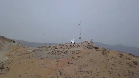 Drone view of two people on top of a mountain.   Stock Footage 145083422