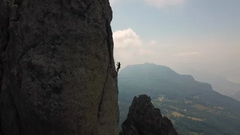 Drone view of two person climbing a rock Stock Footage 92690816