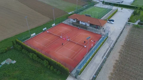 Drone view of two tennis courts from above. With active players Stock Footage 109521938