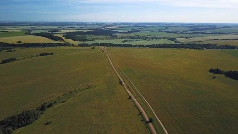 Drone view under green field with road Stock Footage 105274923