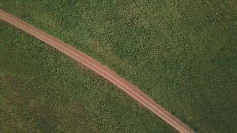 Drone view under green field with road Stock Footage 105274931
