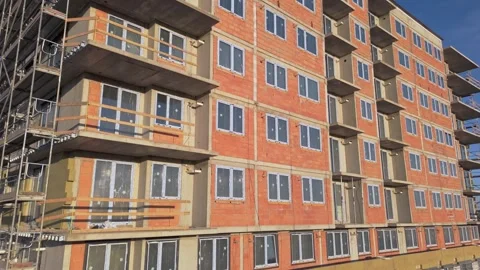 Drone view of a  undergoing exterior thermal insulation, multi story buildi.. Stock Footage 333699548